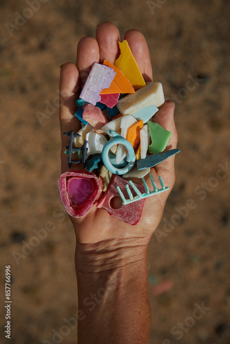 Coastal Micro Plastic Pollution held in a hand from Hawaii Beaches