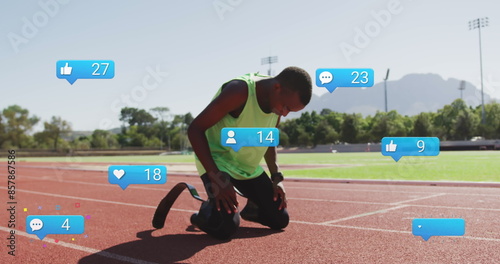 Image of notification, african american man with prosthetic leg kneeling on track and screaming