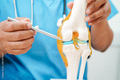 Knee osteoarthritis, Doctor showing model knee joint orthopedic.