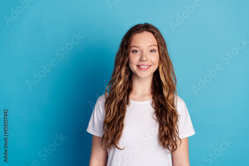 Photo of adorable lovely cute woman wear white stylish pajama empty space isolated on blue color background