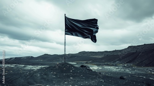 In a stark landscape a black flag flies upwards its ascent signifying triumph over adversity.