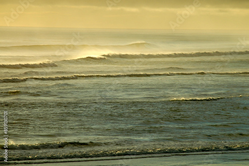 Strolling on the beach under the winter sun in New Zealand