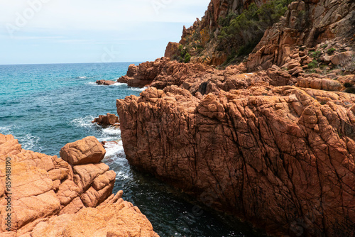 Red porphyry rock formations on Su Sirboni , province of Nuoro, Sardinia (Sardegna) island, Italy. Tyrrhenian Sea.