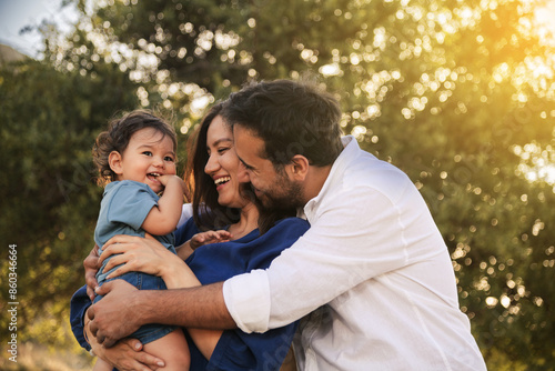 Happy Family Embracing in Nature