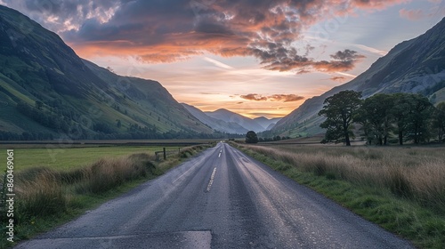 Lake District Panorama Photo with Road stretching out into the Distance. Beautiful Mountain Scene at Sunset.