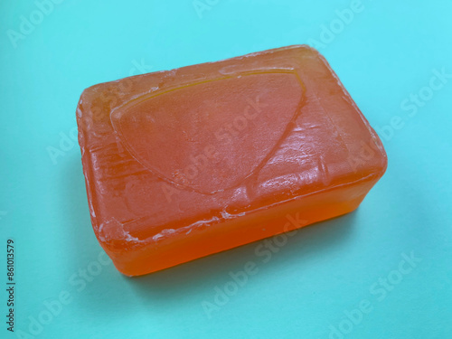 Glycerin soap isolated on cyan background.