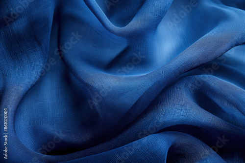 Blue chiffon fabric flowing in the wind creating abstract shapes