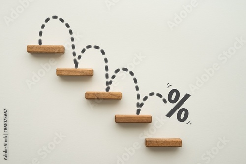 Percent sign moving down from top stair on white background. Central banking system of the United States FED (Federal Reserve System) cut interest rate, world finance and economy concept.