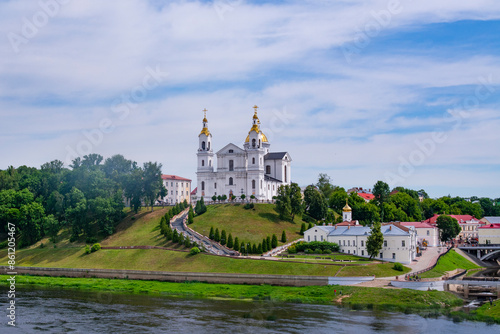 Vitebsk,Belarus - JUNE 20, 2024: Holy Assumption Cathedral of the Assumption on the hill and the Holy Spirit convent and Western Dvina River. Vitebsk, Belarus