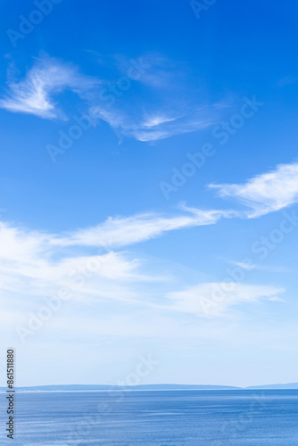 Blue Sky With White Clouds Over Calm Ocean Water