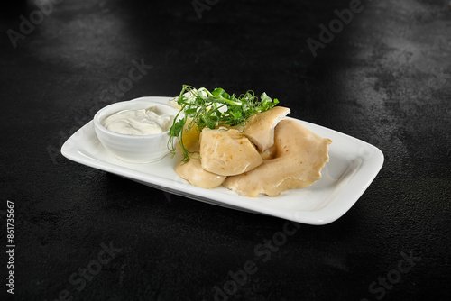 Salted Mushrooms with Sour Cream: Traditional Russian Cuisine on White Plate