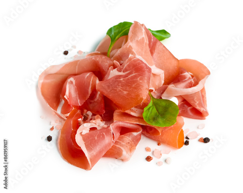 Slices of tasty prosciutto with basil on white background