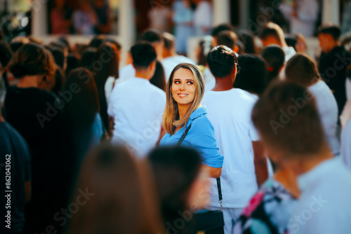 Smiling Woman in a Crowded Place Standing Out. Special individual being unique in her community opt people 