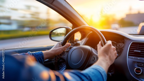 A person driving a car, hands on the wheel and eyes on the road, with a calm and focused demeanor.