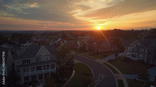 An awe-inspiring aerial view captures a new construction cul-de-sac in a Maryland upper-middle-class neighborhood. Luxury houses grace the dead-end street, and the picturesque sunset sky.