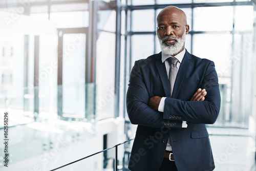 CEO, portrait and mature black man with arms crossed for corporate career, business and leadership. Face, professional and confident entrepreneur, manager or investment advisor in office in Kenya