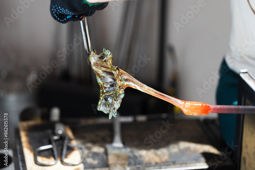 Sculpting flower of molten glass