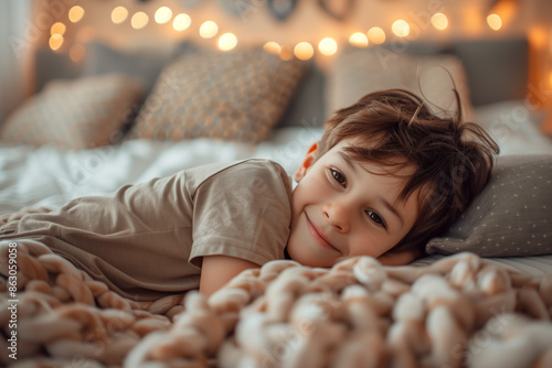 Cute little preschool boy relaxing lying on bed in lazy morning. Generative AI.