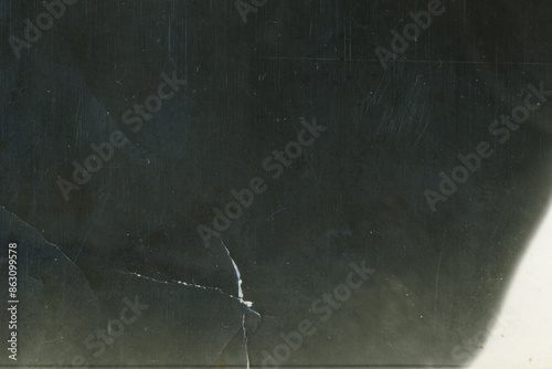 Vintage dirty grunge scan photo paper texture. Old black photo worn overlay distressed background. Vintage scratched glitch effect for design. Folded Edges. Rough grunge shabby torn ripped texture.