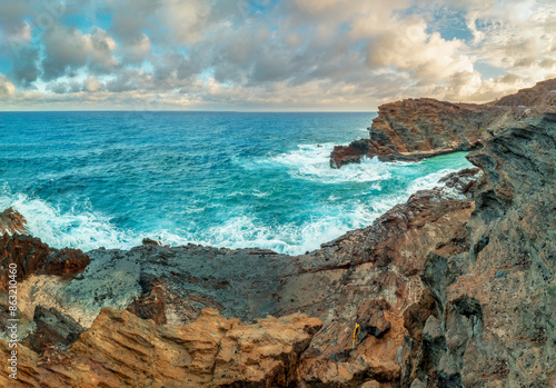 Halona Hawaii Beach Cove and the view to the lava coast with deep blue Pacific Ocean waves