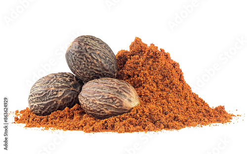 Ground nutmeg and group of whole nutmegs isolated on a white background