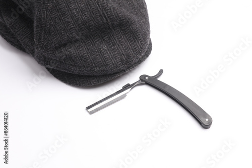 Straight razor with eight-bladed cap on a white background