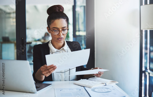 Laptop, paperwork and report with business woman at work in office for law firm or case thinking. Computer, data and documents with female attorney working on lawyer report or online court review