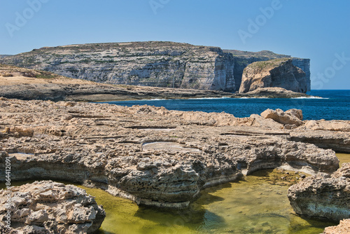 GOZO, MALTA -25 JUNE 2024- Fantastic views of rocky coast on a sunny day with blue sky. Picturesque and gorgeous scene. Location famous place Azure Window, Gozo island, Dwejra. Mediterranean sea Malta