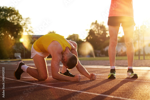 Very upset Losing athlete in a race at the stadium