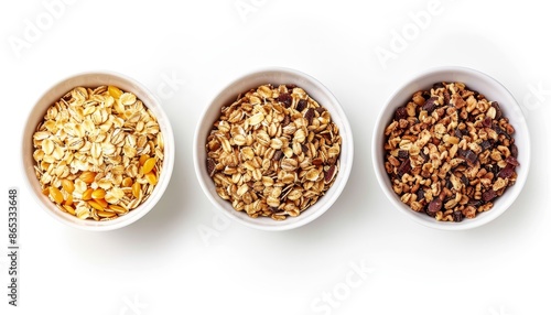 Whole grain muesli in white bowl isolated on white background seen from above