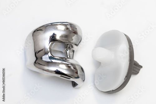 Set of orthopedic knee replacement implants on white background