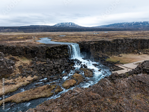 Aerial panorama of Oxarafoss waterfalls in Thingvellir National Park, Iceland, featuring the scenic Oxara River and the unique landscape created by the tectonic plates of America and Eurasia.