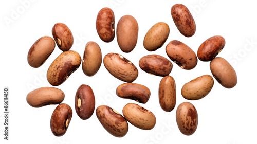 Close-up of multiple pinto beans scattered , showcasing their unique speckled patterns and brown hues.