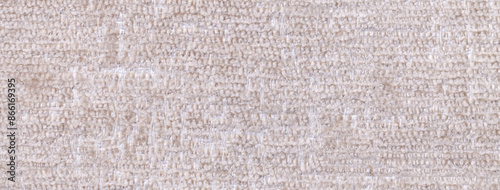 Texture fluffy woolen beige textile background from soft fleecy material, macro. Cream fabric with pattern