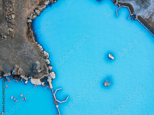 Aerial view of the Blue lagoon in Iceland. The most famous and popular SPA place in Iceland. Landscape from air. Vacation image. Blue and hot water in geothermal lake.