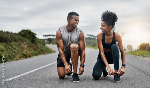 Nature, fitness and couple tie shoelace in road with running exercise for race or marathon training. Sports, outdoor and people of track and field athletes preparing for cardio workout in mountain.