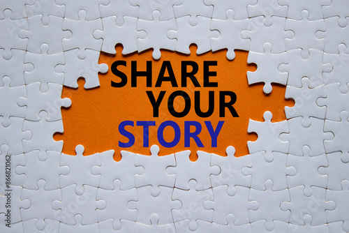 Share your story symbol. White puzzle with words Share your story. Beautiful orange background. Business and Share your story concept. Copy space.