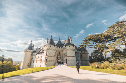 A lone wanderer approaching the majestic chateau de saumur