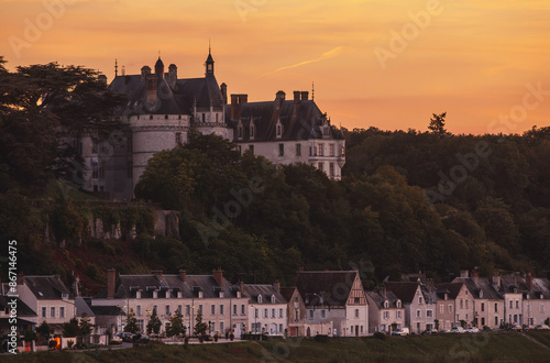 A golden sunset casts its glow on the chateau of langeais