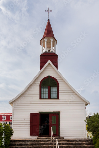 The historic 1747 wooden Sainte-Croix chapel - the oldest wooden church in Quebec and Canada - at 169 Du Bord-de-l’Eau street in Tadoussac, Quebec, Canada