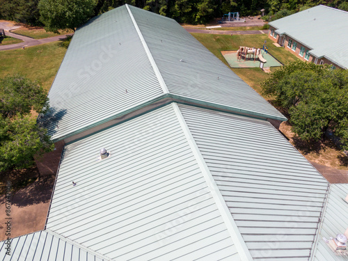 Daytime Drone Images of a Commercial Standing Seam Metal Roof on an Elementary School. 