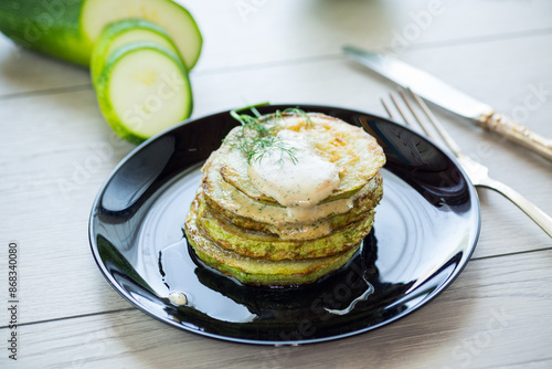 zucchini fried in batter with sauce