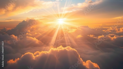 heavenly dawn breathtaking sunrise sky with dramatic rays of golden light piercing through layered clouds creating a celestial spectacle above misty landscape