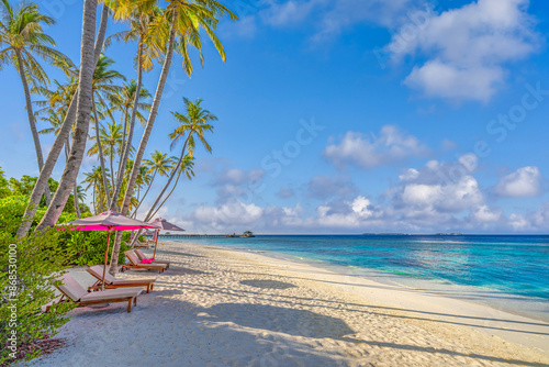 Beautiful panoramic sea sand sky. Tropical relax beach sunny summer island landscape. Love couple chairs umbrella palm leaves romantic coast. Luxury travel destination. Honeymoon vacation best tourism