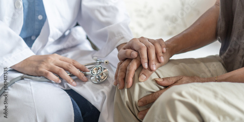 Parkinson disease, arthritis hand and knee joint pain, or osteoporosis bone elder patient with geriatric or orthopedic doctor consulting examining old senior aged elderly woman in medical clinic room