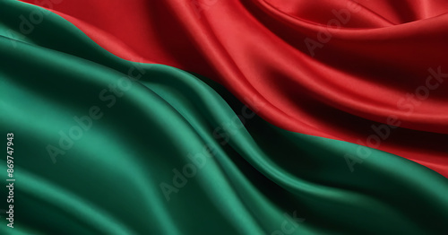 Close-up of red and green fabric with a silky texture, resembling the Belarusian flag. Ideal for political, cultural, or textile-themed content.