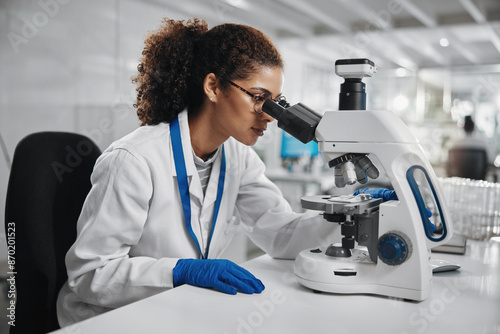 Microscope, woman check and virus research of science study with healthcare, scientist and laboratory work. Analysis, testing and medical professional with investigation for scientific journal