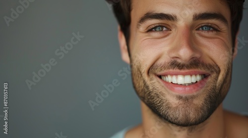 close-up photo, Young man with beautiful smile on grey background