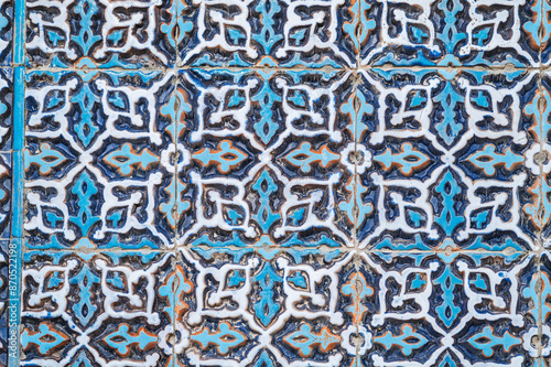 old wall of Muslim mosque Hazrati Imam is decorated with ceramic tiles with traditional oriental Uzbek ornament and Islamic pattern in Uzbekistan