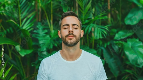 Focused man practicing deep breathing exercises in a lush green forest, breathwork, inner calm, nature connection